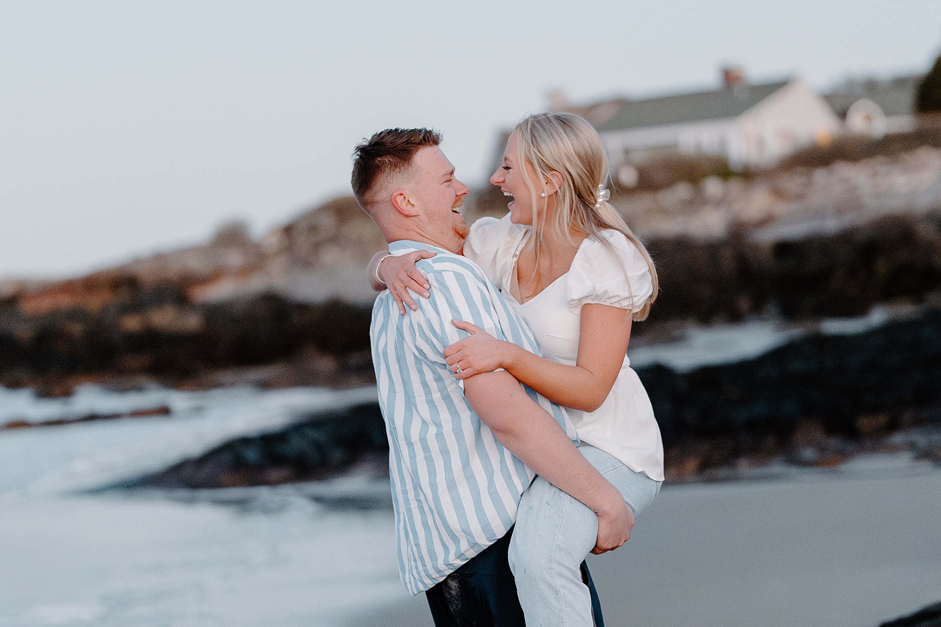 candid and fun beach engagement in Maine