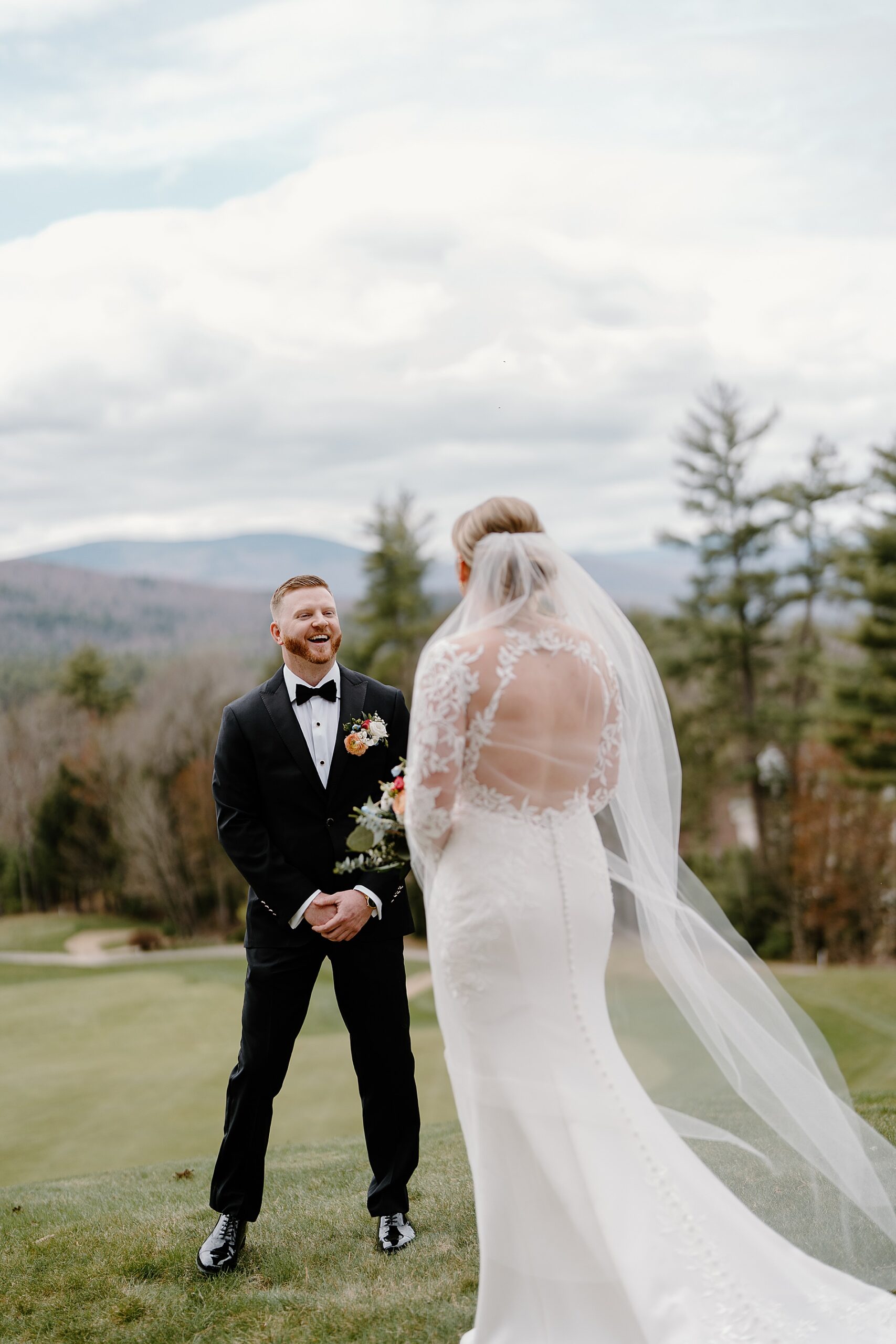 candid reaction of groom seeing bride for the first time