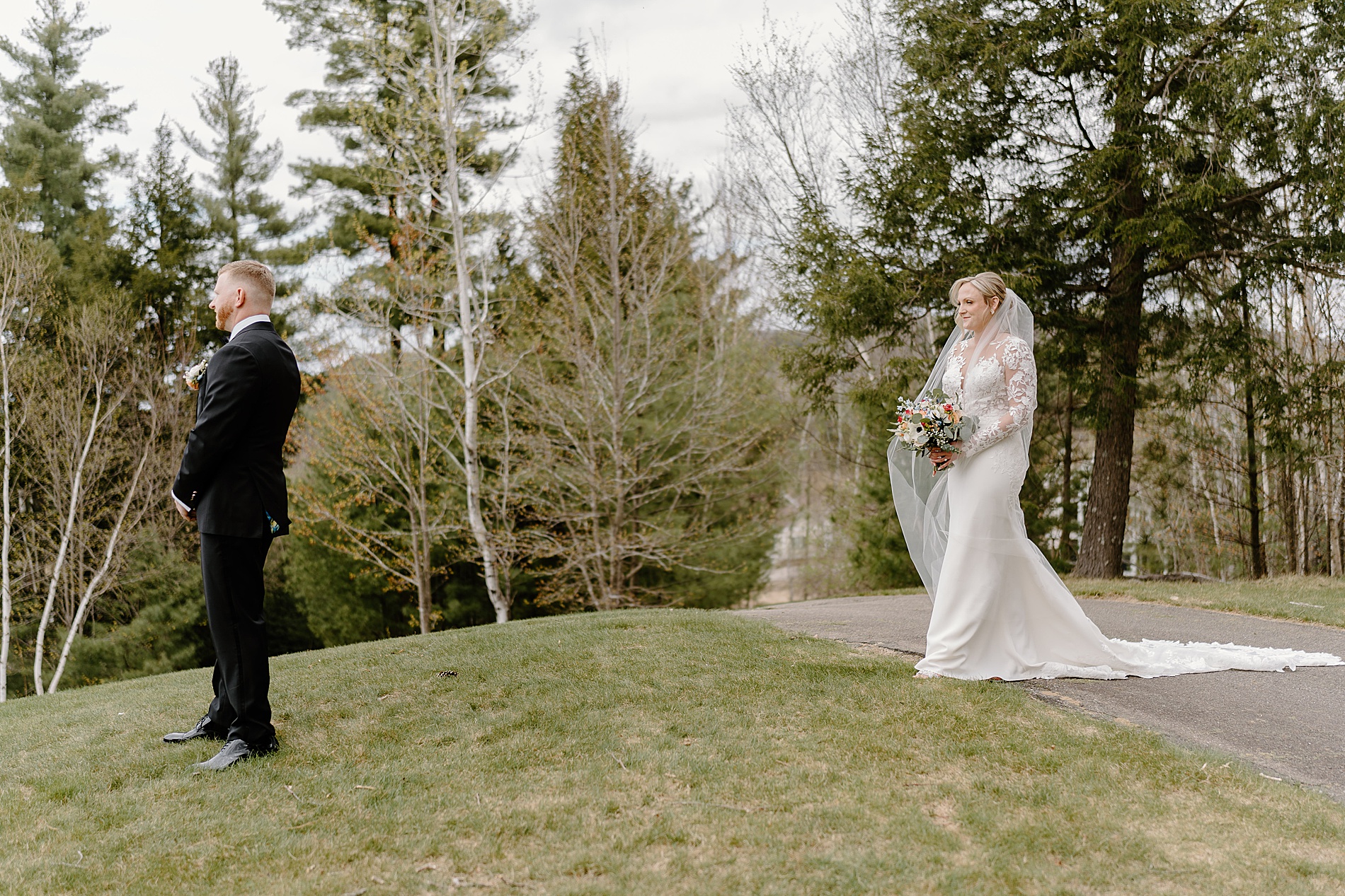 bride approaches groom for first look 
