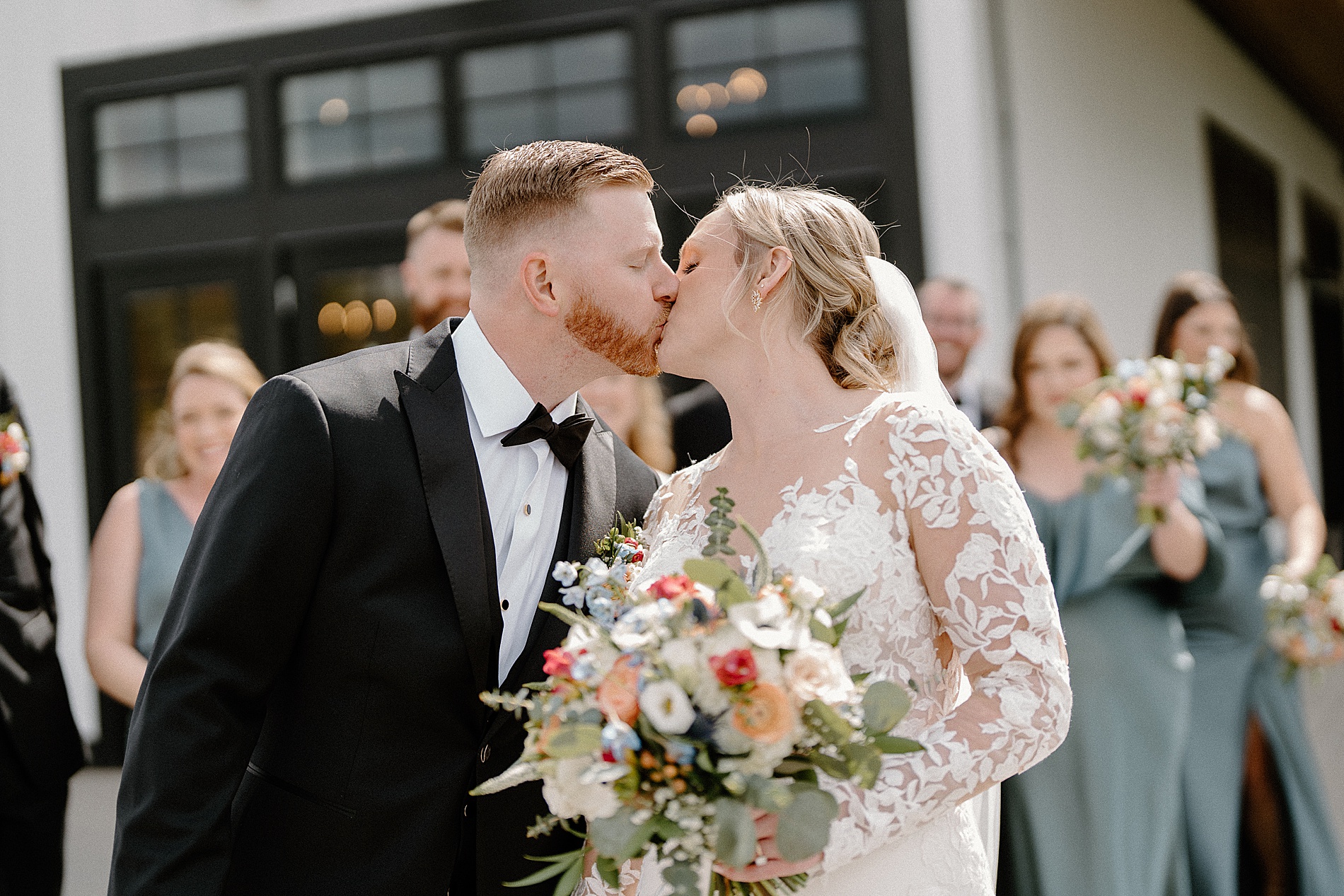bride and groom kiss 