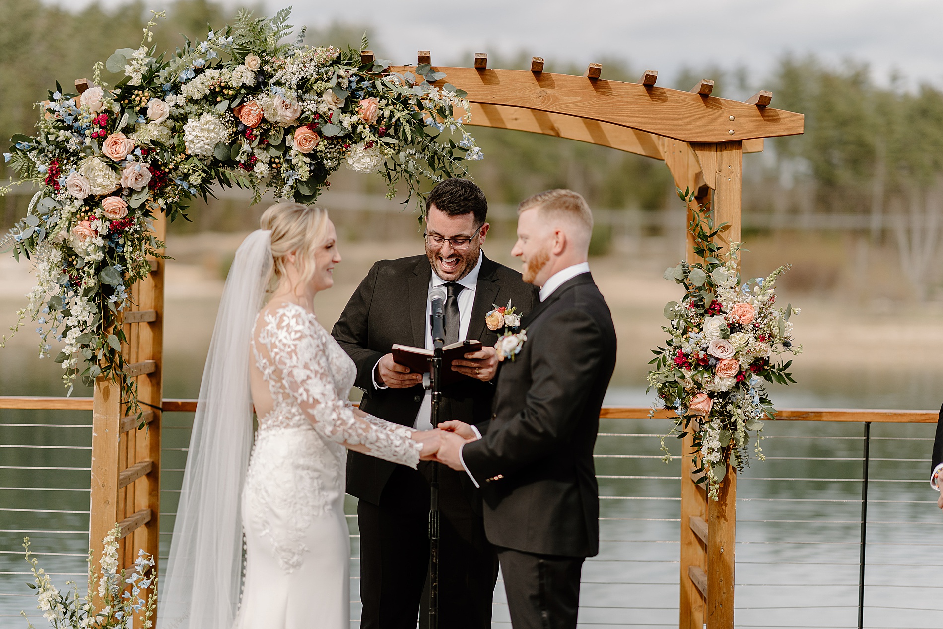 bride and groom exchange wedding vows at Owl's Nest Resort Wedding 
