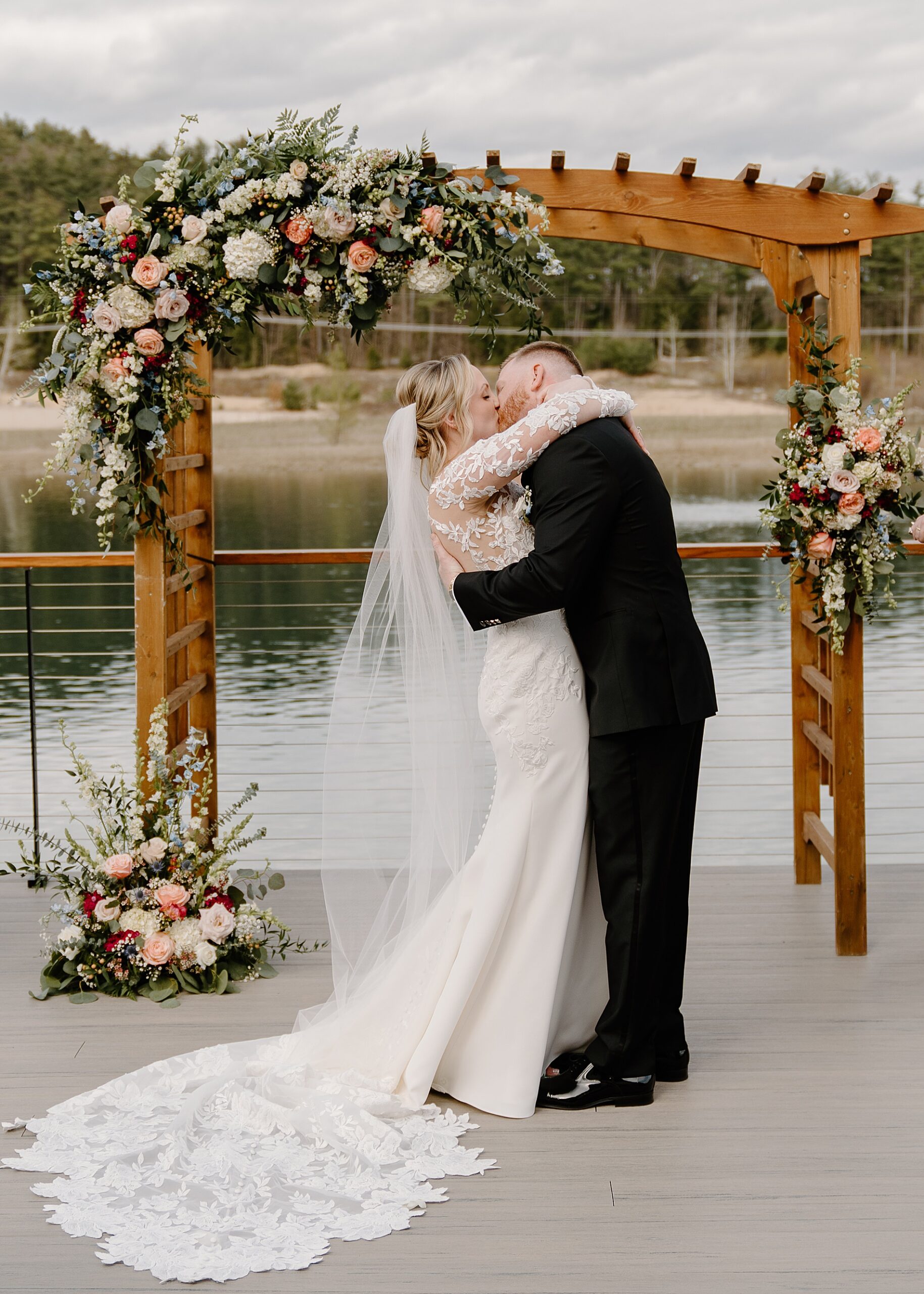 bride and groom kiss at wedding ceremony at Owl's Nest Resort Wedding 