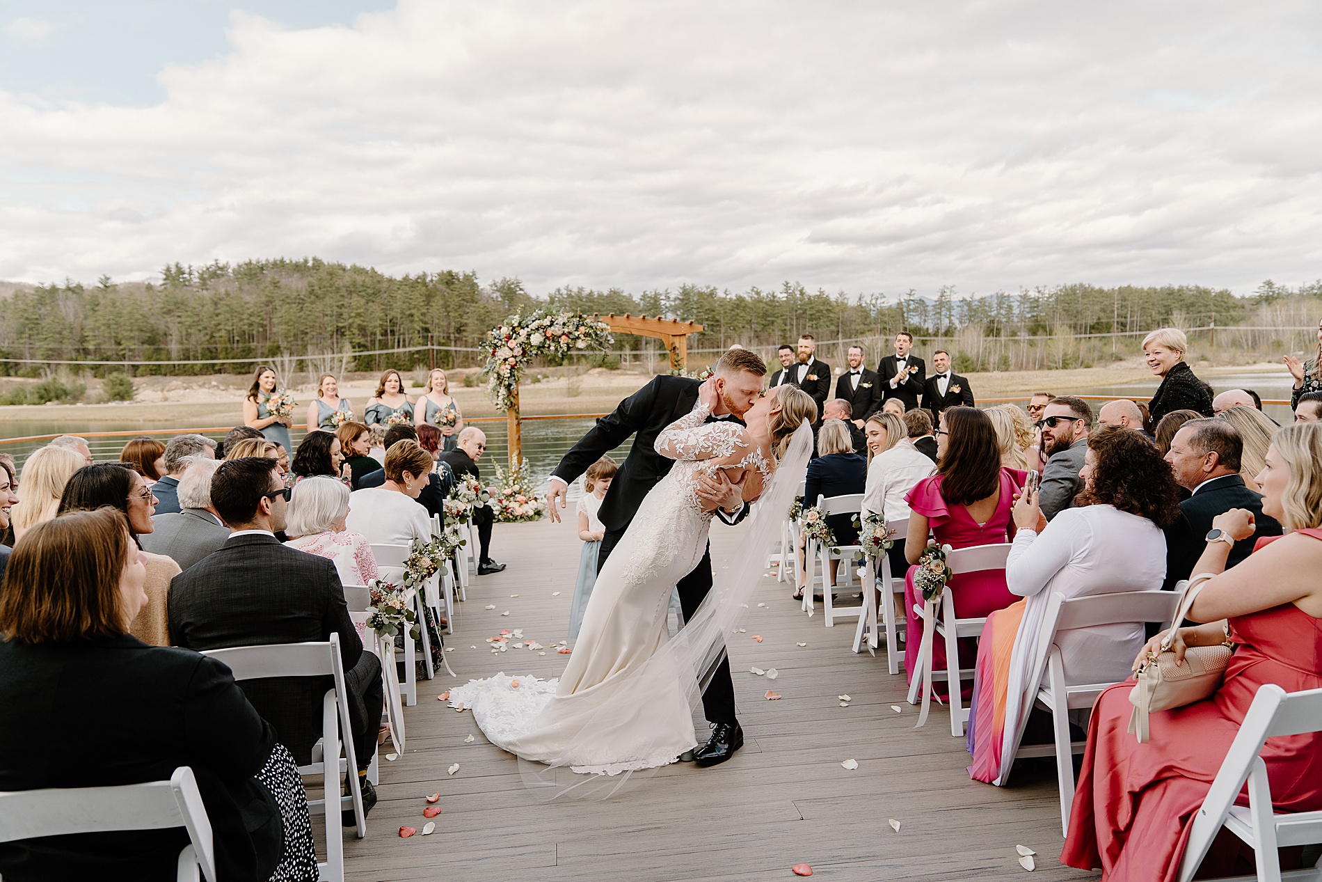 newlyweds kiss as they exit wedding ceremony 