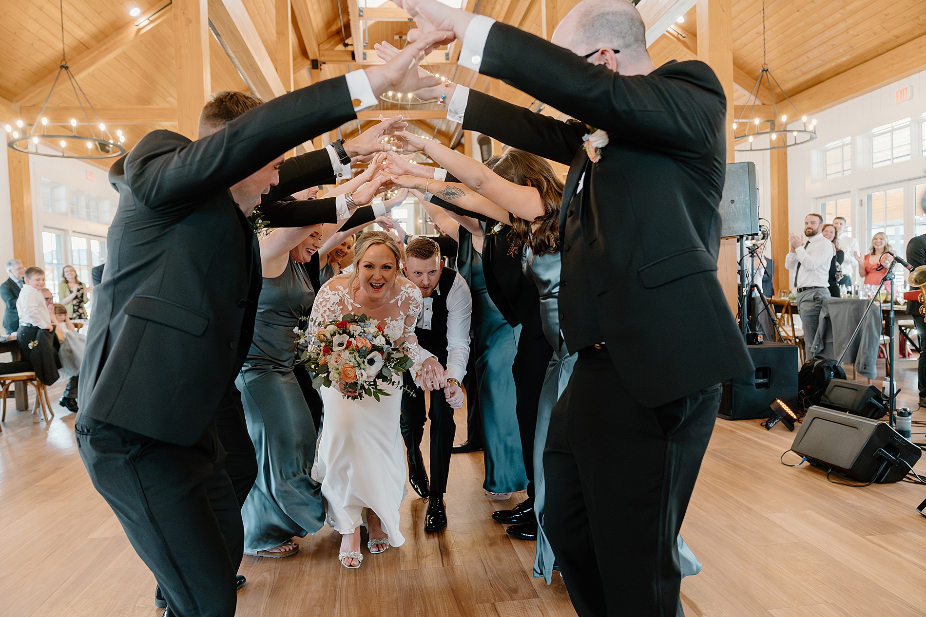 bride and groom enter wedding reception