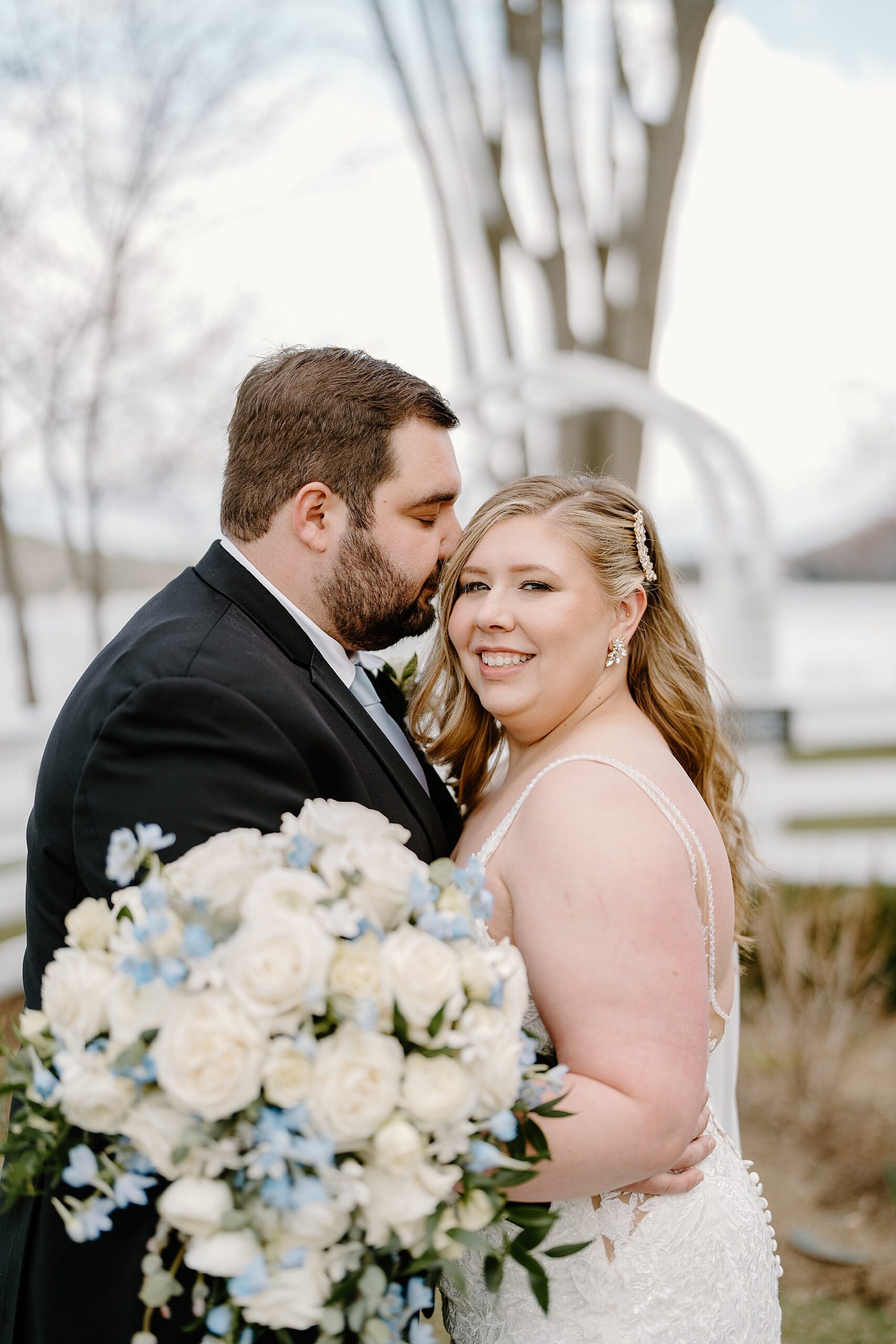 classic white bridal bouquet with pops of blue
