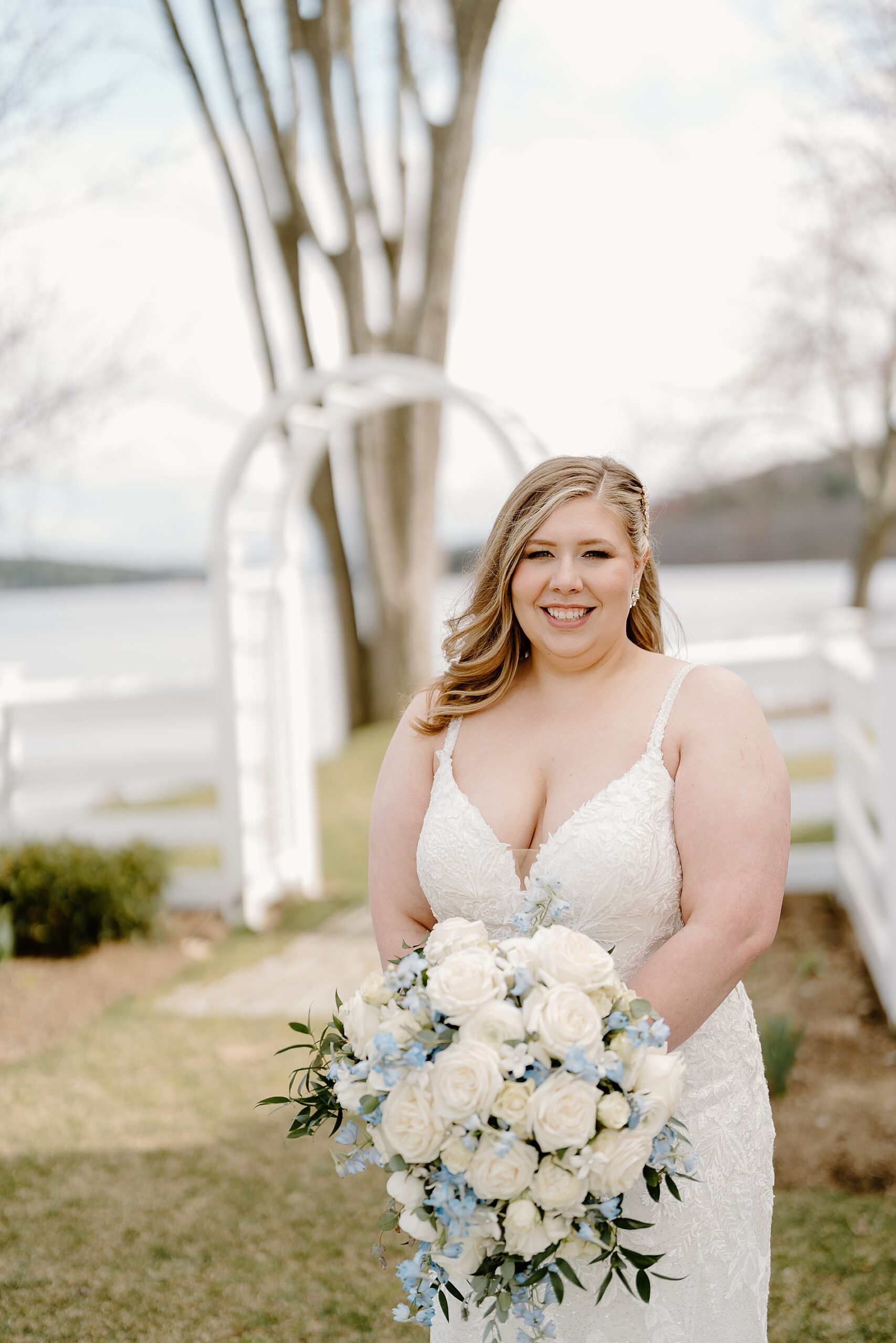 bride holding classic white bridal bouquet