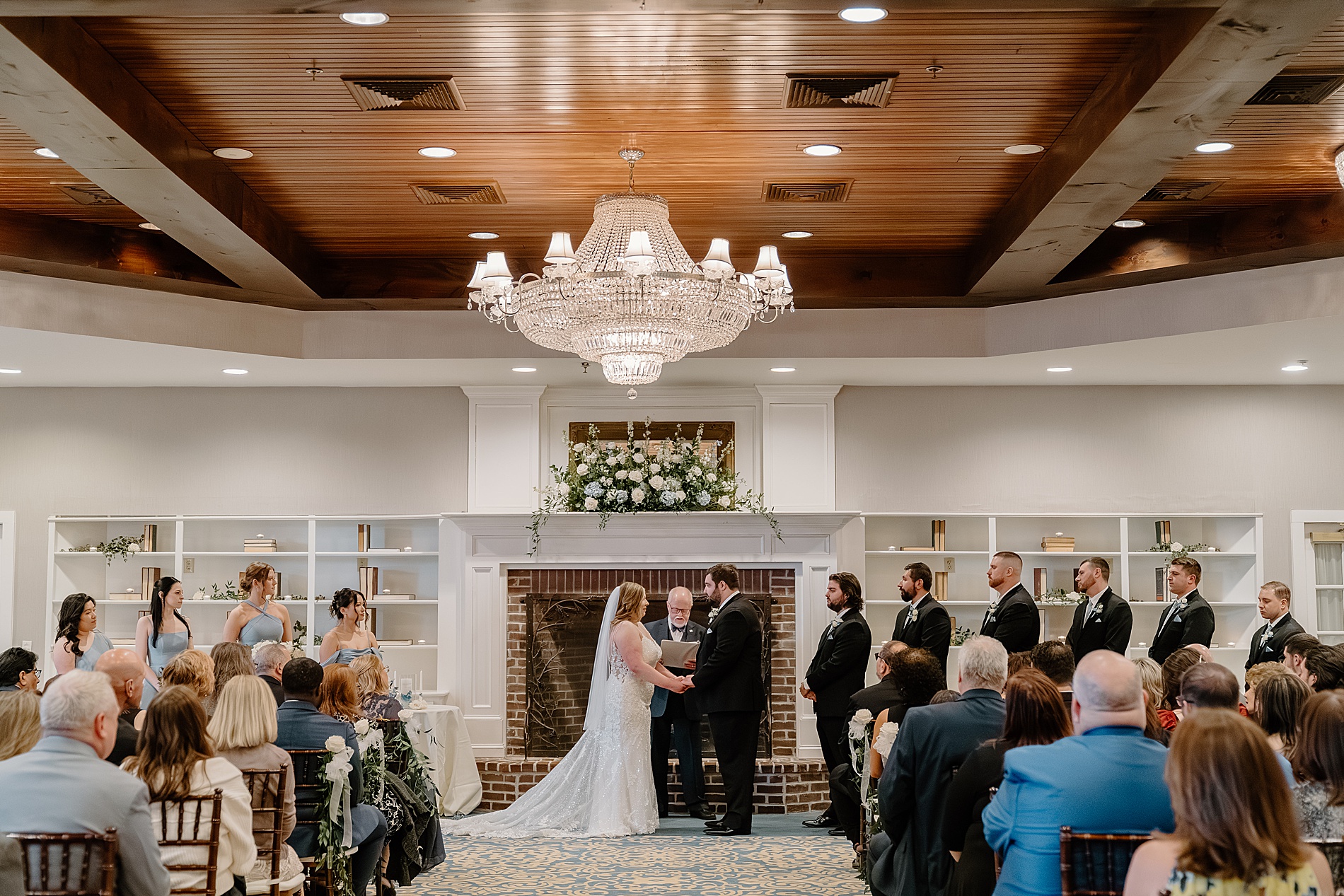 bride and groom exchange vows at wedding ceremony