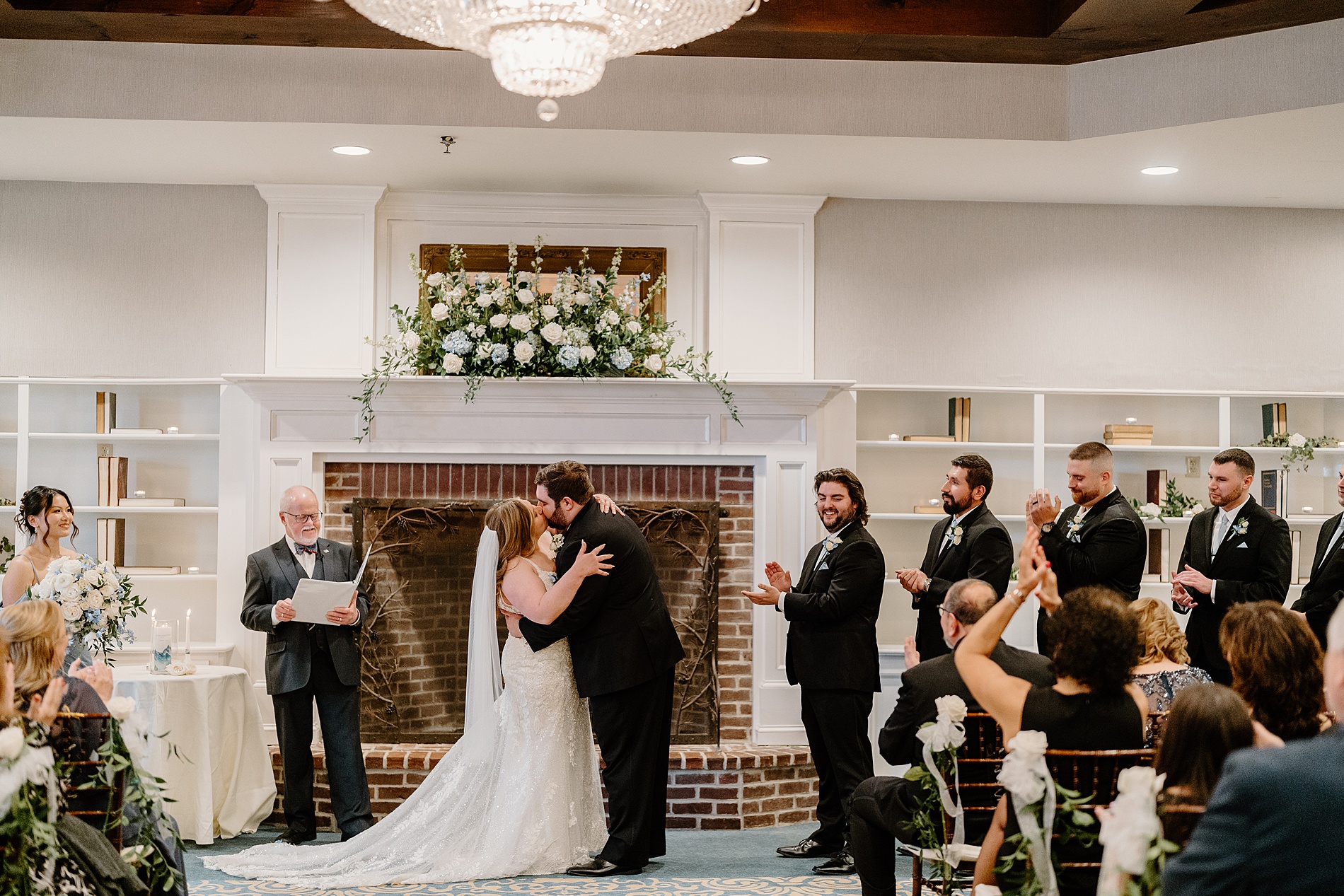 couple kiss during wedding ceremony