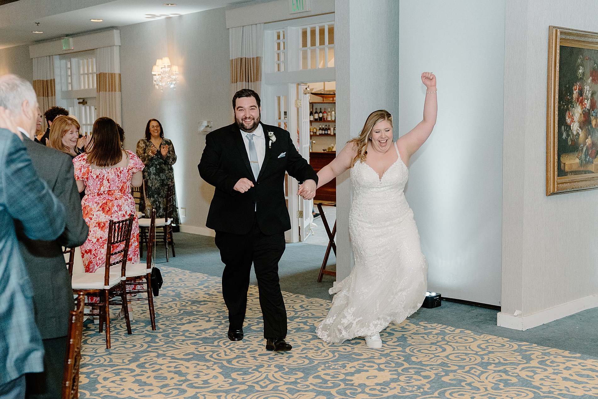 newlyweds enter wedding reception