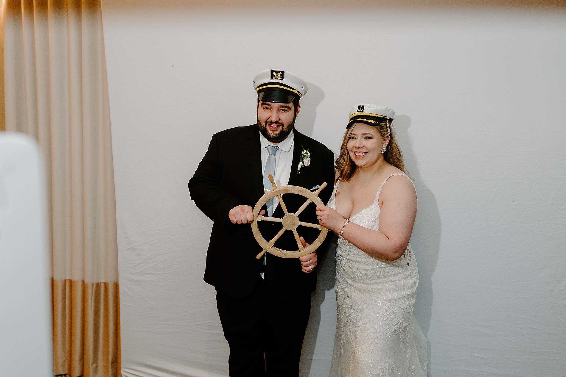 newlyweds in captain hats 