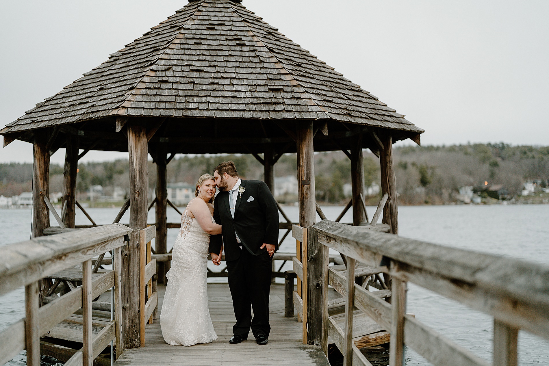 wedding portraits on dock at Lake winnipesaukee