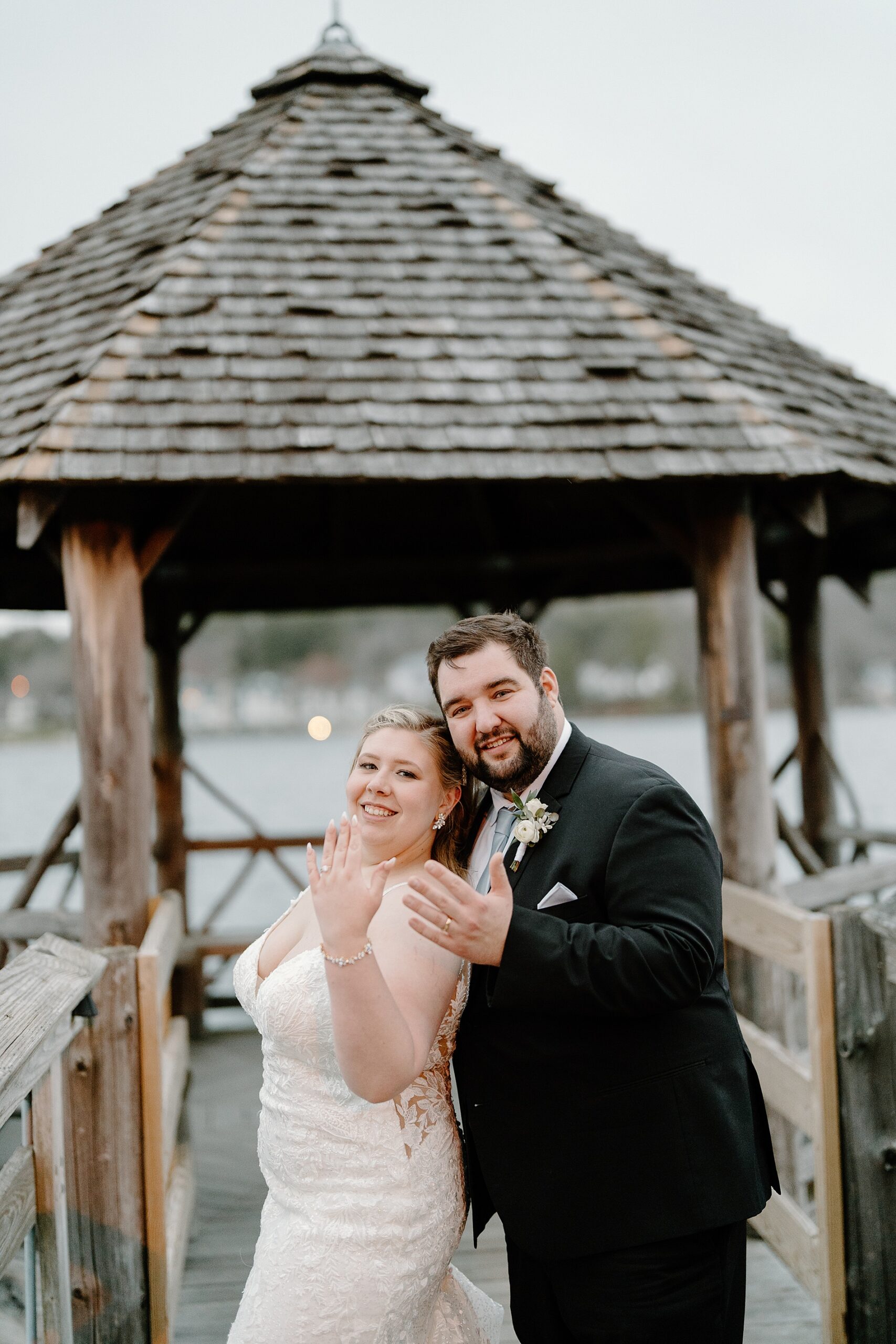newlyweds show off wedding rings 